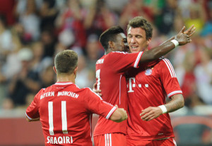 Mario Mandzukic (right) celebrates scoring the winner against Manchester City. Photo: DPA